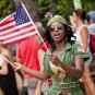 Westin Resort troop member Carries US flag at St. John Carnival