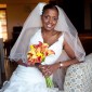 Bride holds flowers in room at Westin Resort, St. John